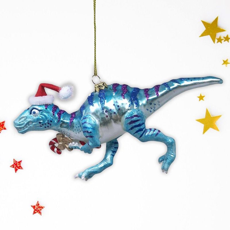 ForProductChristmasThemeDinosaurRaptorGlassOrnamentWhiteBackgroundGoldRedStarMockup